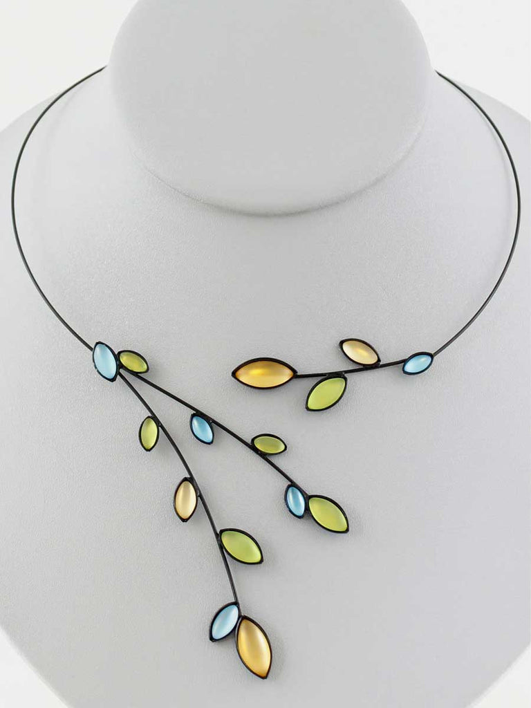 Necklace with yellow, green, and aqua glass beads on a gray display