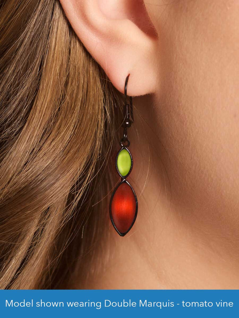 Close up of a model wearing a glass bead earring