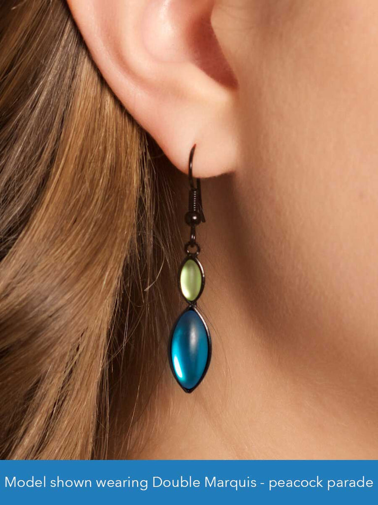 Close up of a model wearing a glass bead earring